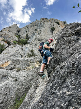 Rock Climbing on a Steep Mountain 