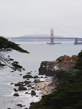 Golden Gate Bridge Over Water With Rocky Coastline View