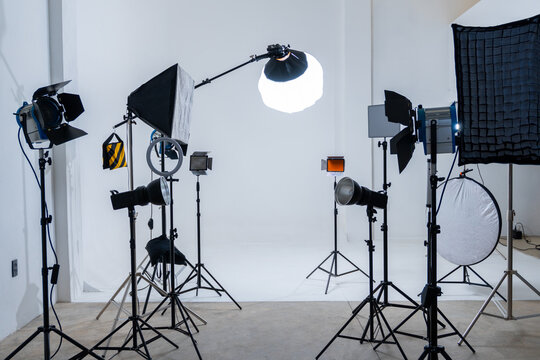 Studio Setup for a Photoshoot With Various Lighting Equipment