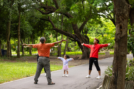 family stretching in city park summer. healthy lifestyle in nature. Father mother, kids daughter exercise together. Family team, healthy children. healthy lifestyle and family bonding