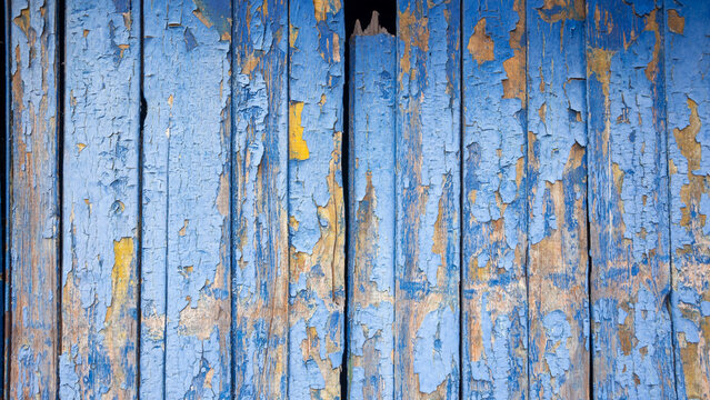 Rustic distressed wood background with flaking paint surface