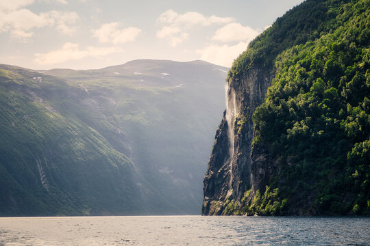Scenic view of waterfall in Geiranger fjord, Norway, Europe