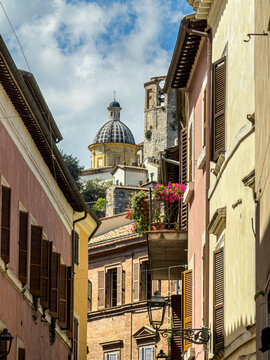 Charming narrow street with traditional architecture in the historic Italian town of Amelia.