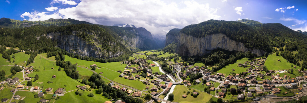 Lauterbrunnen Valley Switzerland Aerial Drone Panoramic View Vertical Cliff Rock Green Alpine Fields Village Scenic Alps Bernese Oberland 16K High Resolution World Print panorama