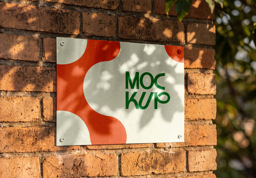 Metal Wall Plaque Mockup on Brick Wall with Leaf Shadow