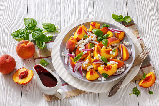 Italian peach salad with cheese, basil leaves
