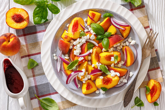 Italian peach salad with cheese, basil leaves