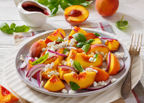 Summer fresh peach salad with red onion and cheese