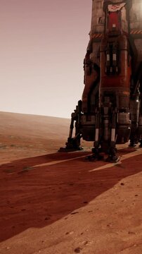 A rocket touches down on the red surface of Mars. Dust rises as it makes contact. The landscape shows red soil and distant hills under a soft sky as shadows stretch behind.