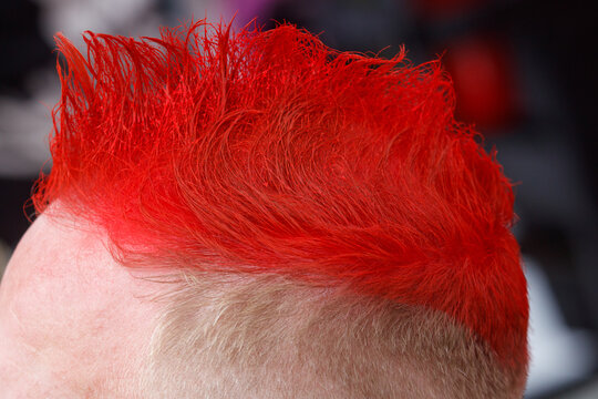 Vibrant red hair styled in a punk fashion