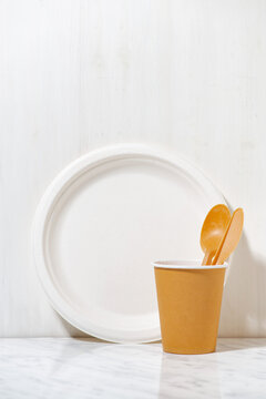 eco-friendly disposable tableware made from recycled materials, closeup vertical