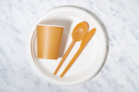 eco-friendly disposable tableware made from recycled materials, top view horizontal