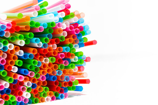 multicolored cocktail tubes on white background