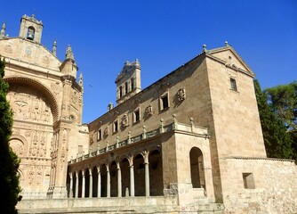 Fototapeta premium Outside view of the Old Cathedral of Salamanca and the famous Torre del Gallo dome during golden hour, Spain.