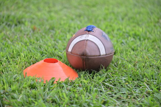 Football by an Orange Cone