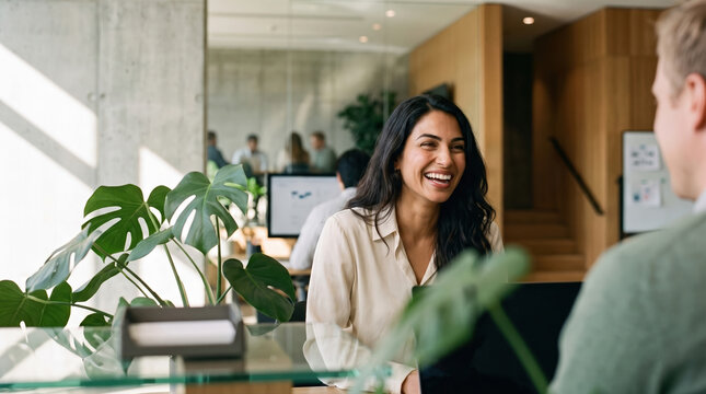 Business meeting between colleagues in a modern open office