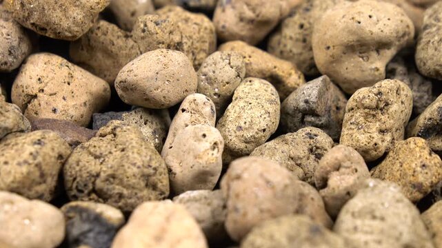 Clay balls as a drainage. Drainage materials for a potted houseplant, side view, background