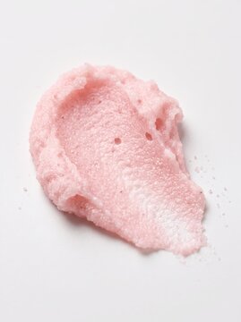 Delicate pink cream texture with soft pastel background