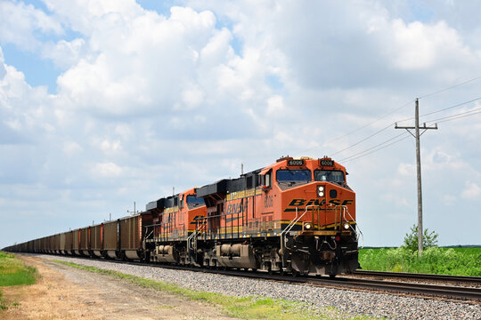 Two Burlington Northern Santa Fe locomotives provide front-end power for an eastbound loaded coal train stretched to the horizon as it passed through north central Illinois.