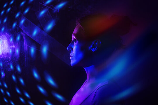 Woman in neon cyberspace with virtual reality concept