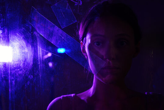 Woman in neon cyberspace with virtual reality concept