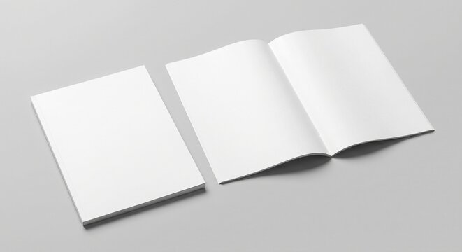 High angle studio mockup of a closed vertical magazine and open two page spread with blank white matte paper on a solid gray surface.