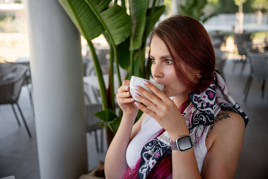 Freelancer enjoys coffee in a stylish outdoor cafe