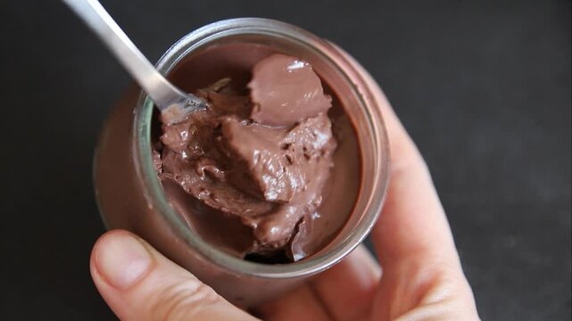 Chocolate pudding in a glass jar Chocolate mousse sweet dessert, natural ingredients food preparation tasty snack fresh and delicious gourmet food background on the table rustic food top view copy spa