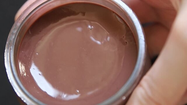 Chocolate pudding in a glass jar Chocolate mousse sweet dessert, natural ingredients food preparation tasty snack fresh and delicious gourmet food background on the table rustic food top view copy spa