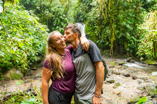 Friends explore waterfall in Mindo, Pichincha, Ecuador