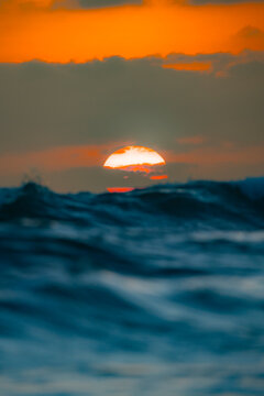 Sunset over ocean waves in Santa Elena, Ecuador