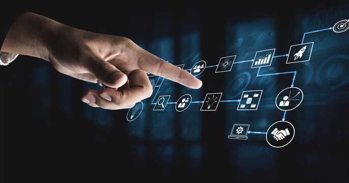 Hand Selecting Digital Icons Representing Business Process and Data Strategy in Innovative Technology with Blue Background and Graphical User Interface Elements Quark.