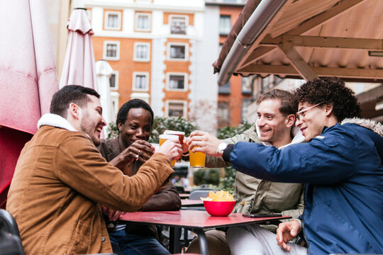 Friends enjoying drinks at an outdoor bar
