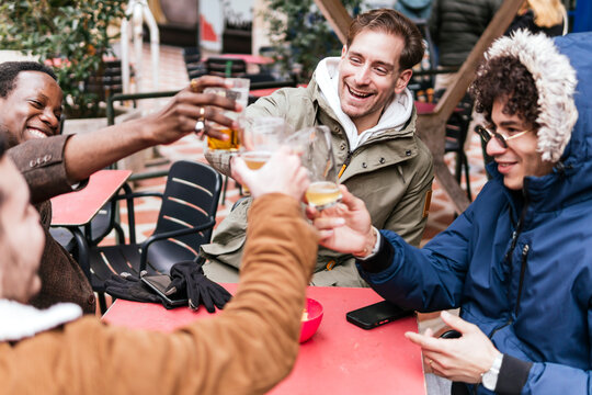 Friends enjoying a casual gathering on a bar terrace