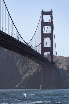 Golden Gate Bridge towering above windsurfing on Bay