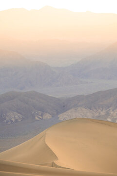 Sunrise haze over Mesquite Flat sand dunes, Death Valley