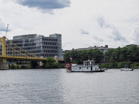 Rachel Carson Bridge and paddlewheel riverboat on the Allegheny River in Pittsburgh Pennsylvania with sky copyspace
