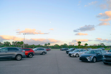 Naklejka premium Selective focus car parked at parking lot. Used car for sale and rental service. Car insurance background. Automobile parking area. Car dealership and dealer agent Miami