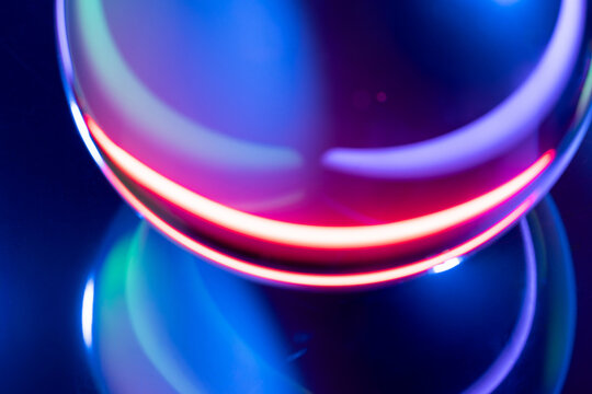 Neon light rings on abstract blue and pink background