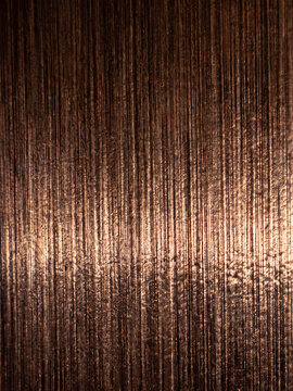 Dark brown scratched metal texture with vertical lines