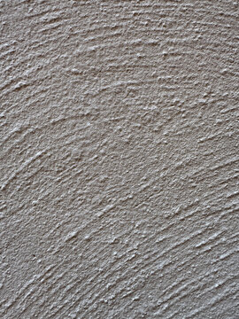 Gray rough plaster wall texture background with copy space