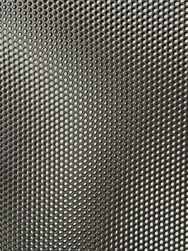 Abstract metallic perforated mesh texture background pattern