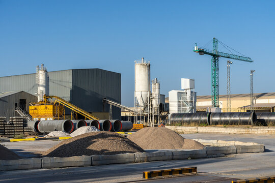 Precast factory with construction materials and machinery