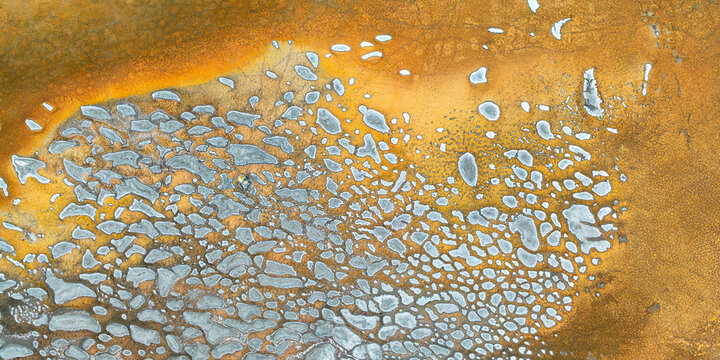 Aerial view of abstract mineral patterns in vivid colors