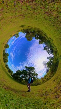 Hiker walking through a beautiful green valley in izta popo park