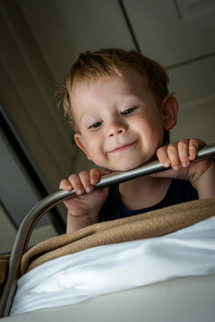 Smiling toddler on a berth train during family vacation