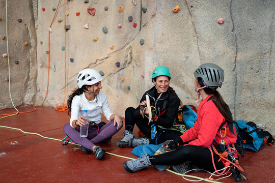 Women climbers take a break during indoor caving training