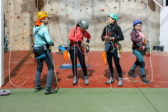Women prepare for indoor climbing and caving training