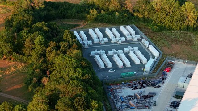 Close up aerial view of Battery Energy storage Systems BESS lithium ion cells at large electrical substation in Enderby, UK.