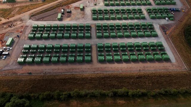 Aerial view of containerised lithium iron phosphate BESS energy storage units at UK utility site